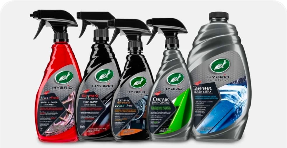 Five Turtle Wax Hybrid Solutions car care products including sprays and a wash jug.